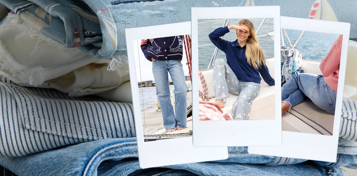 Three overlapping instant photos placed on folded blue-and-white striped and denim fabrics. The center photo shows a smiling woman sitting on a sailboat in a navy top and light blue sailboat-print jeans, shading her eyes from the sun. The left photo shows a cropped view of someone in a navy sweater and flared jeans standing barefoot on a dock, and the right photo shows a person in a pink sweater and jeans sitting on a boat seat by the water.