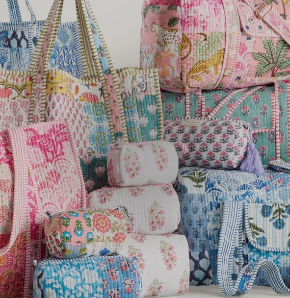 Image of patchwork strawflower tote, cosmetic bags, and duffel bags.