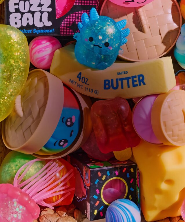 Image of a basket of various squishy toys, featuring NeeDoh, Dumplings, Butter and more