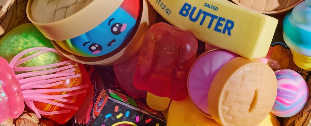 Basket overflowing with colorful squishies and sensory toys.