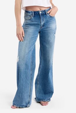waist-down image of model wearing medium wash wide leg jeans