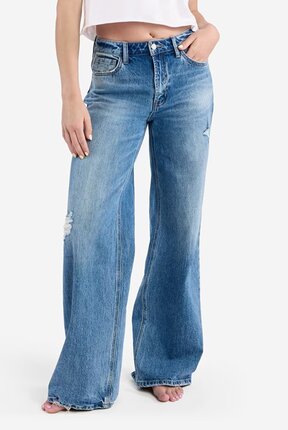 waist-down image of model wearing medium wash wide leg jeans