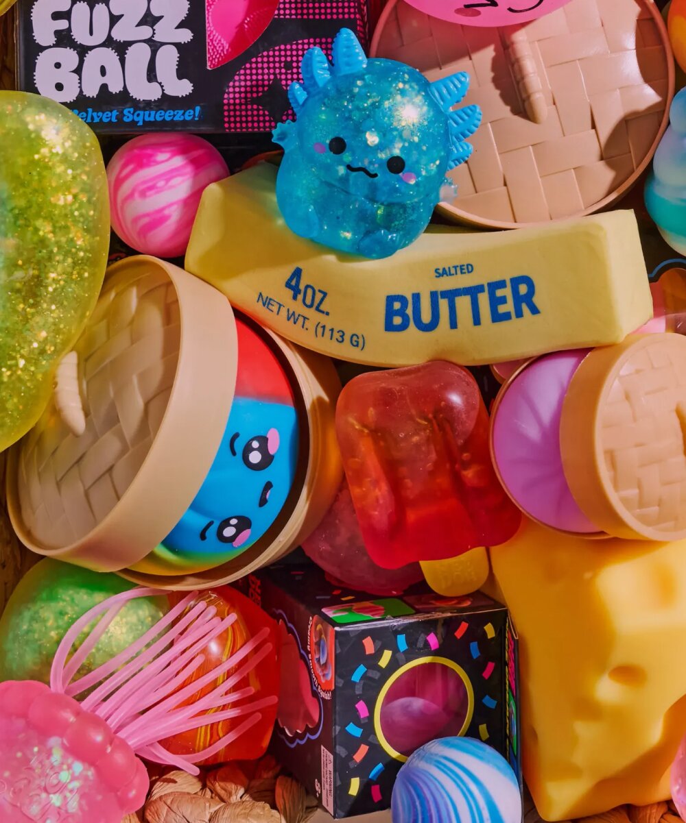Image of a basket of various squishy toys, featuring NeeDoh, Dumplings, Butter and more