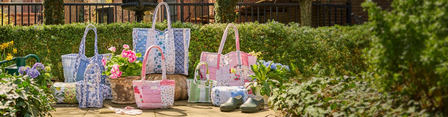 The Strawflower cloud collection spread out on the front steps of a brick home in the spring time. 