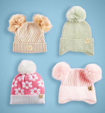 Four kids beanies displayed on a red background