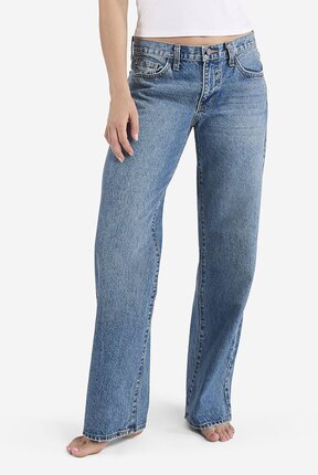 waist-down image of model wearing medium wash low rise jeans