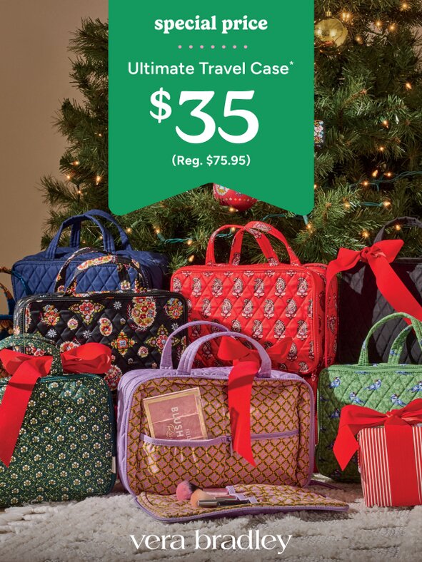 Vera Bradley travel cases sitting under a Christmas tree with red bows on them