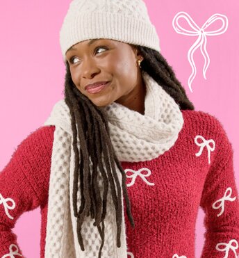 Image of model wearing winter hat and scarf