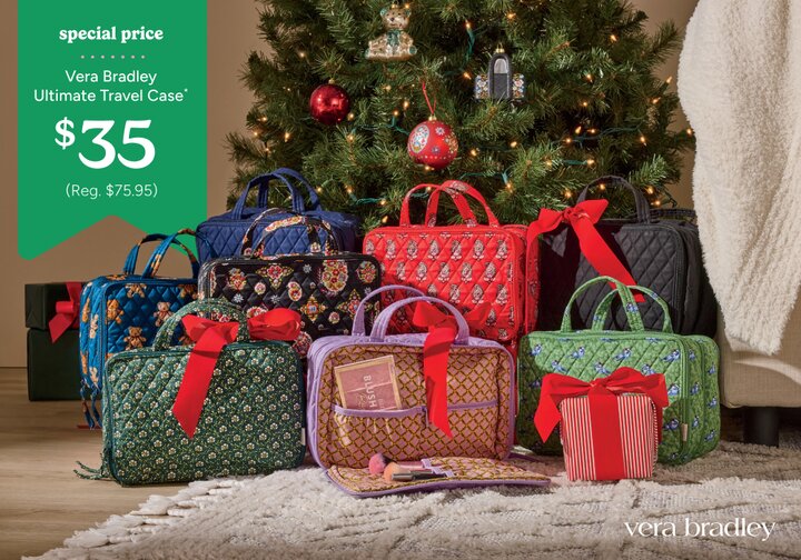 Vera Bradley travel cases sitting under a Christmas tree with red bows on them