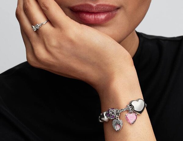 Image of Air & Anchor Cuff Keeper chains. Silver Chain has a red crystal charm and a silver star charm, gold chain has a gold cross charm.