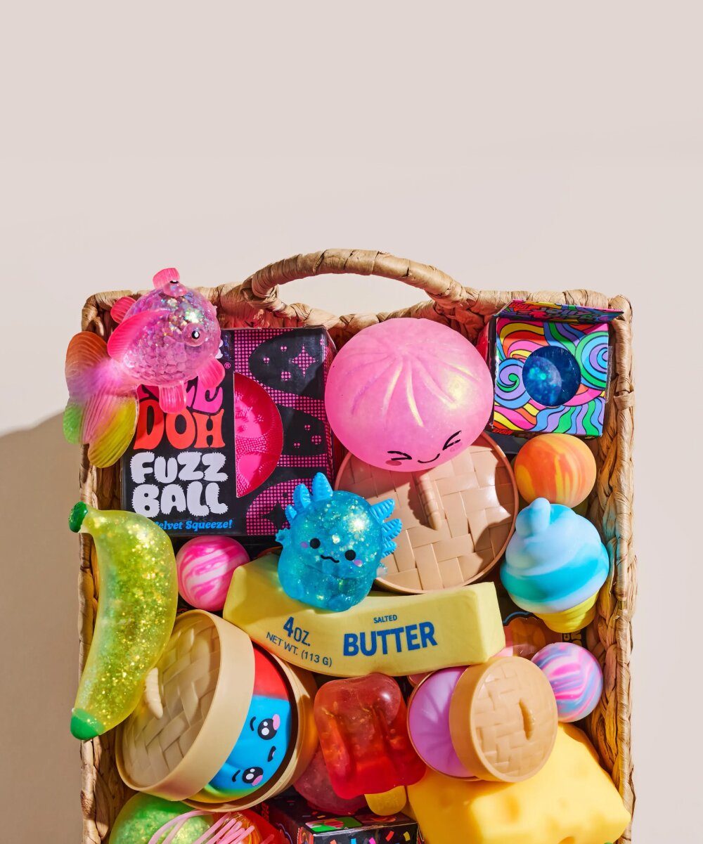 Image of a basket of various squishy toys, featuring NeeDoh, Dumplings, Butter and more