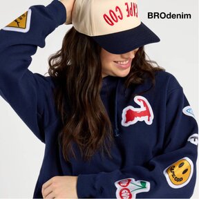 Image of a model wearing a BRODenim Cape Cod hat and sweatshirt