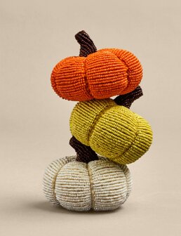 Three decorative LED pumpkins in orange, green, and white with gold stems and leaf-shaped cutout designs.