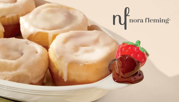 Image of cinnamon buns in a Nora Fleming Pinstripes Border Oval Ceramic Baker Dish with Sweet On You Chocolate Covered Strawberry mini Platter Ornament. Nora Fleming Logo