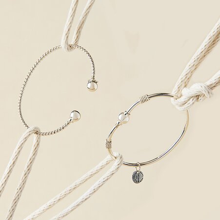 Cape Cod bracelet category featuring two silver bracelets with nautical rope styling.