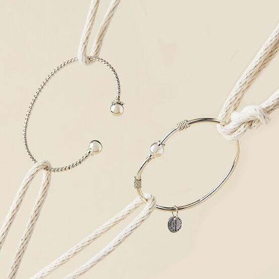 Cape Cod bracelet category featuring two silver bracelets with nautical rope styling.