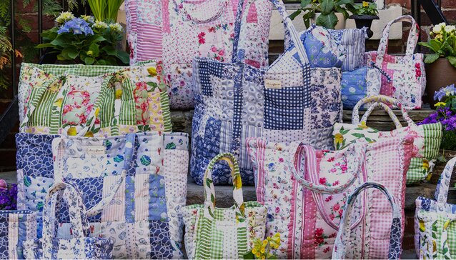 Image of Air & Anchor Cuff Keeper chains. Silver Chain has a red crystal charm and a silver star charm, gold chain has a gold cross charm.