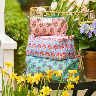 Image of Strawflower block print cosmetic bags in a pile 