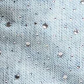 Swatch of light wash denim with beaded embellishment 