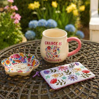 Image of Strawflower trinket dish, beaded pouch and mug that reads "change is beautiful"