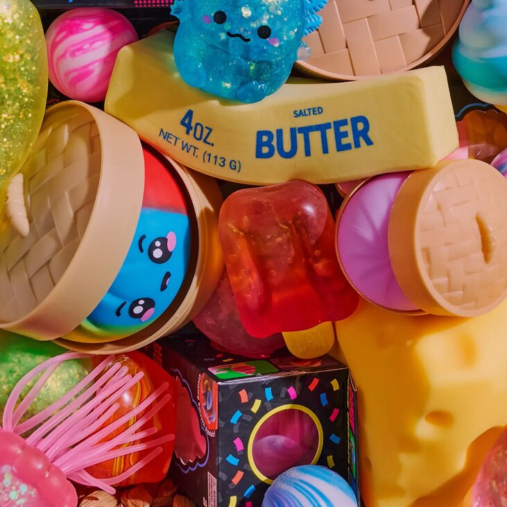 Image of a basket of various squishy toys, featuring NeeDoh, Dumplings, Butter and more