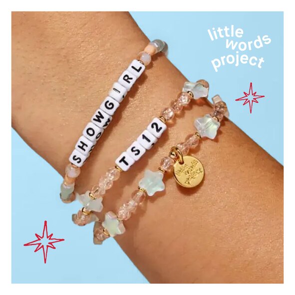 Little Words Project bracelets that say "Showgirl" and "TS12"