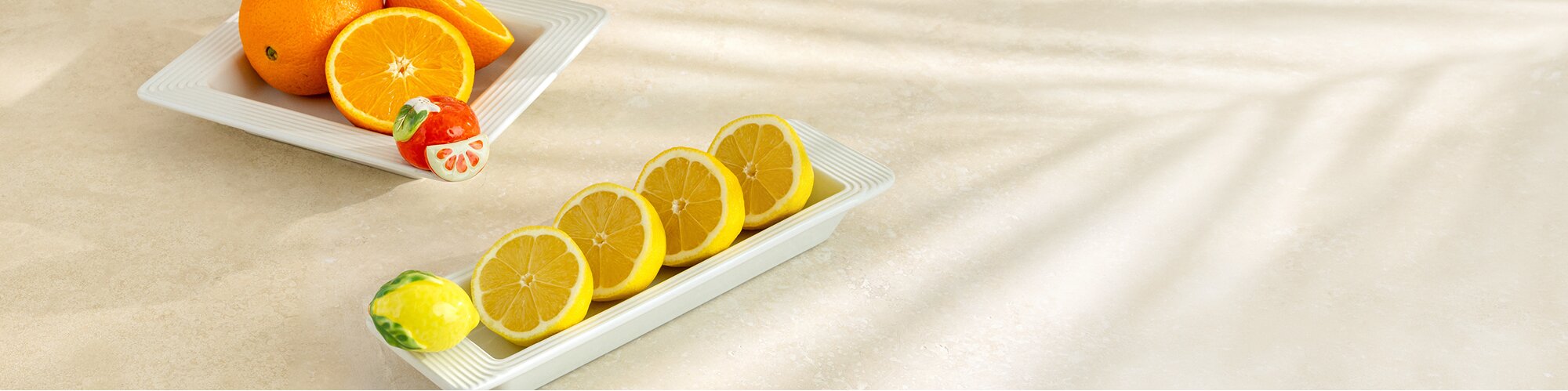 Image of cinnamon buns in a Nora Fleming Pinstripes Border Oval Ceramic Baker Dish with Sweet On You Chocolate Covered Strawberry mini Platter Ornament. 