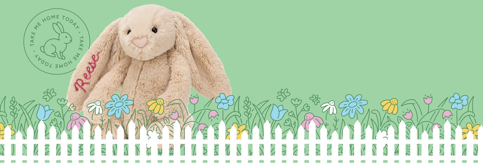 Image of a beige Jellycat bunny with the name Reese embroidered on his ear, sitting behind an illustrated garden of flowers and white picket fence on a light green background
