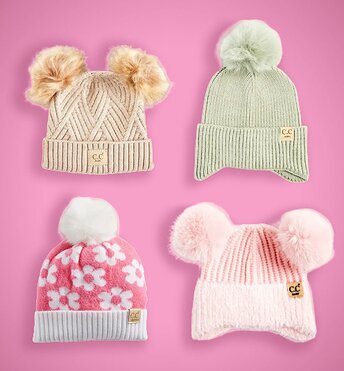 Four kids beanies displayed on a red background