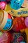 Basket overflowing with colorful squishies and sensory toys.