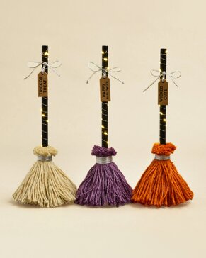 Decorative Halloween LED brooms with festive seasonal designs - 3 for $30