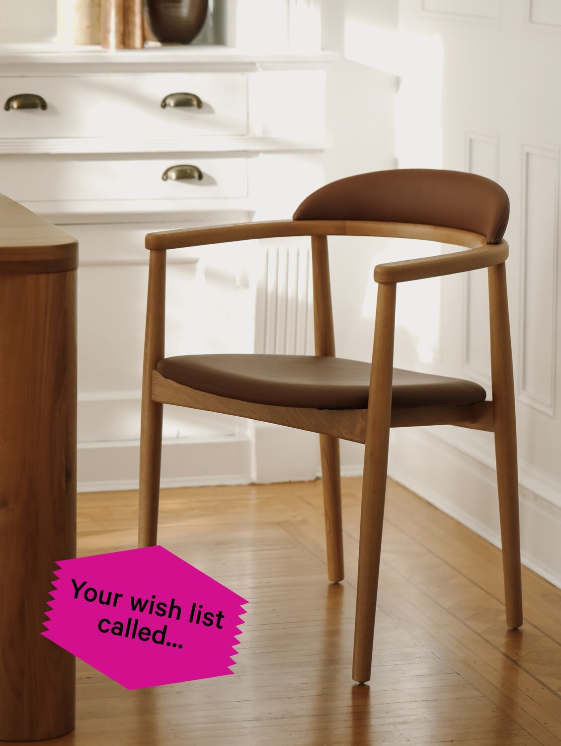 Oak dining chair with brown seating.