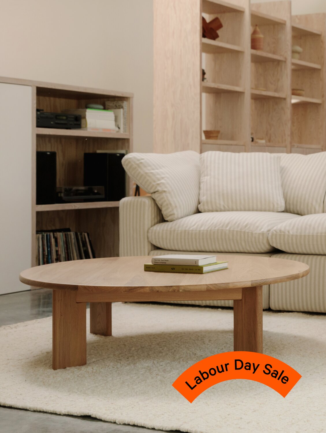 Oak coffee table with orange sale sticker overlay.