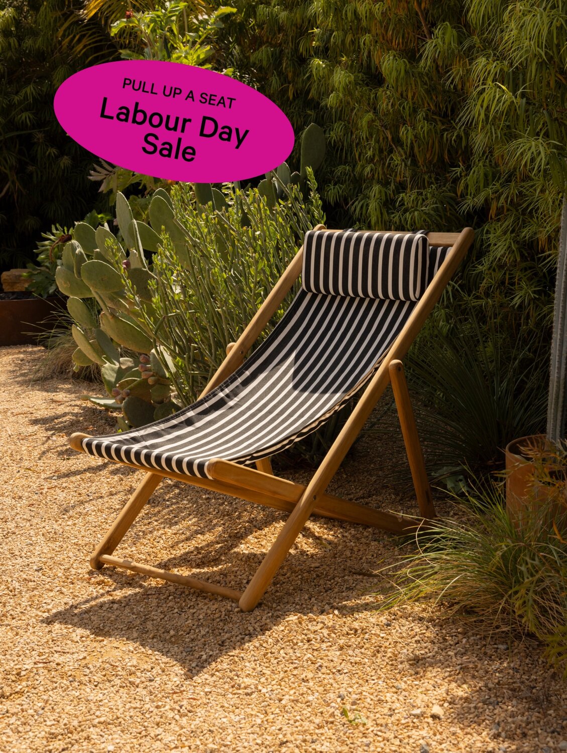 Black and white striped outdoor lounge chair.
