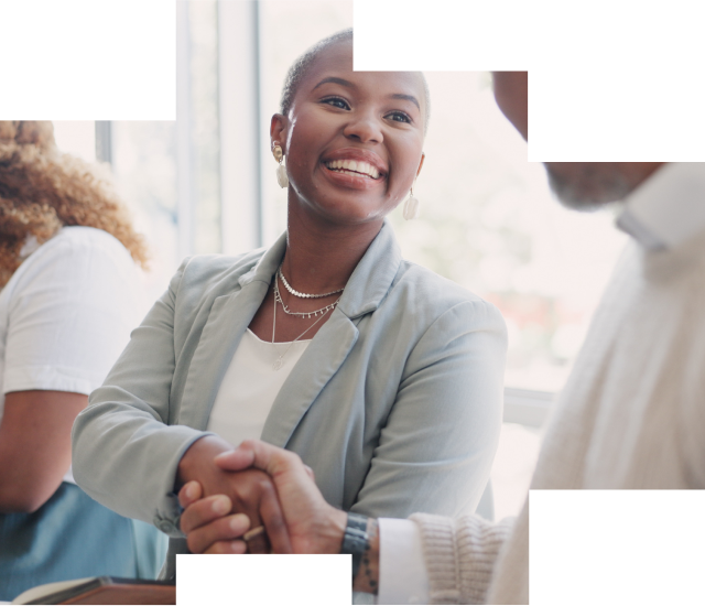 Smiling and enjoying a handshake after another successful meeting.