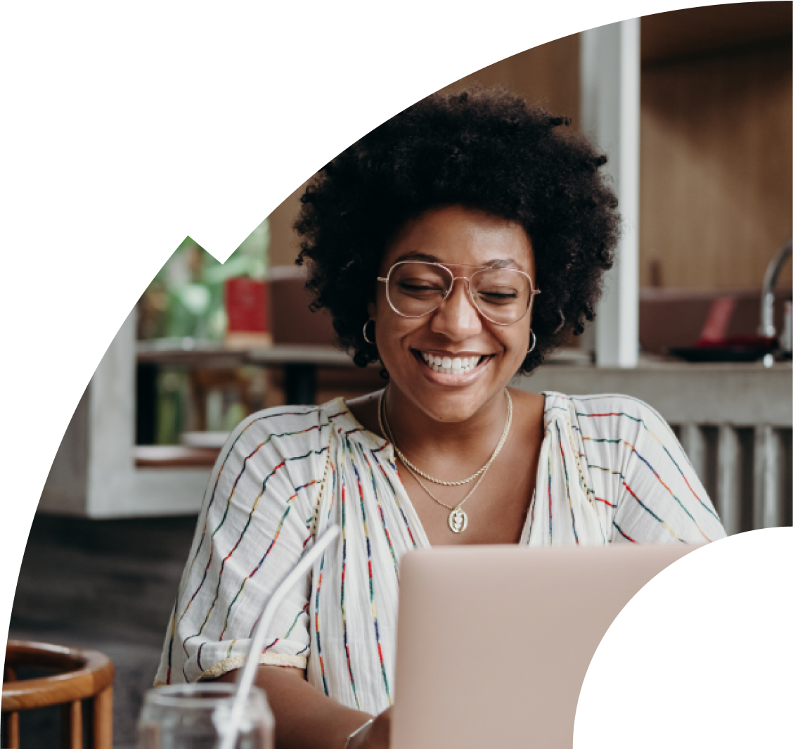 Woman smiling at laptop