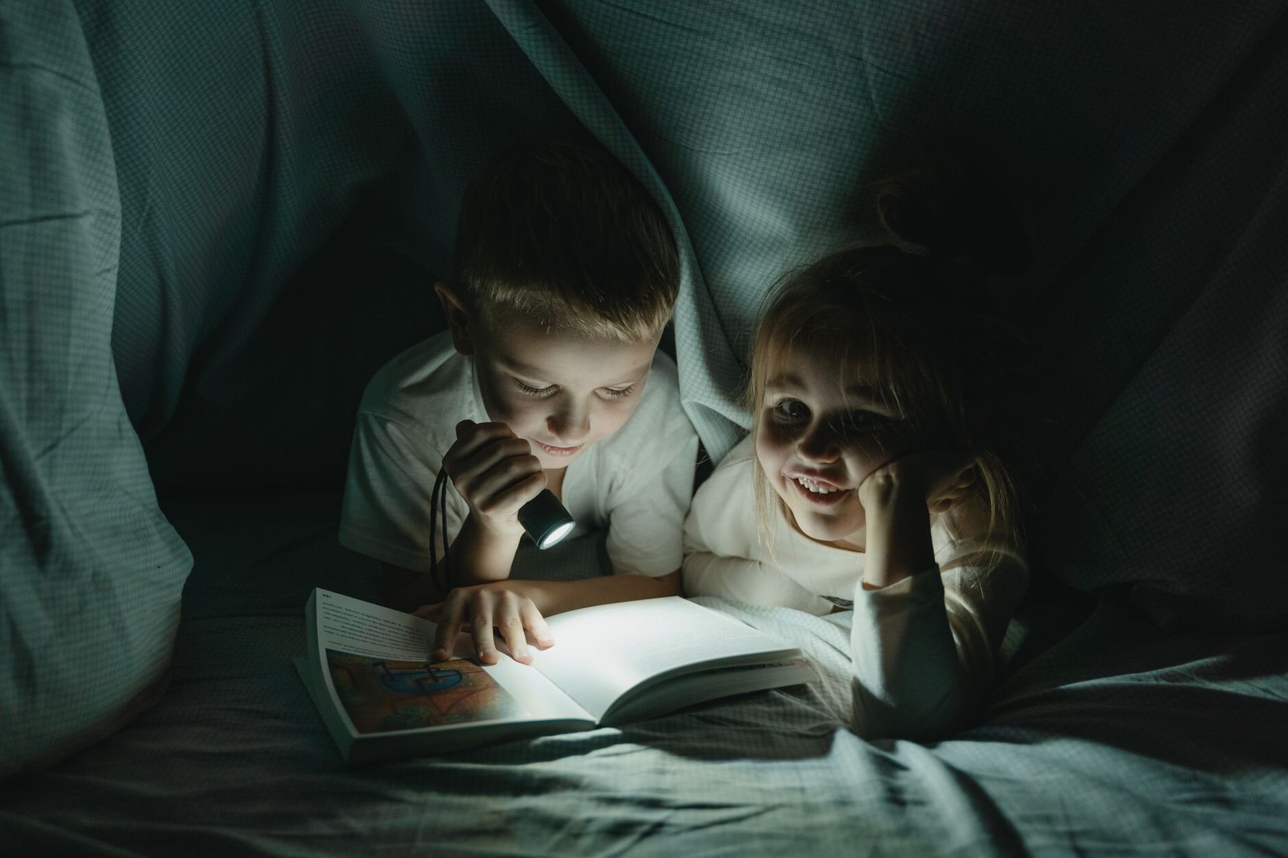 kids in a blanket fort 