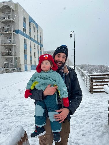 man and boy in the snow