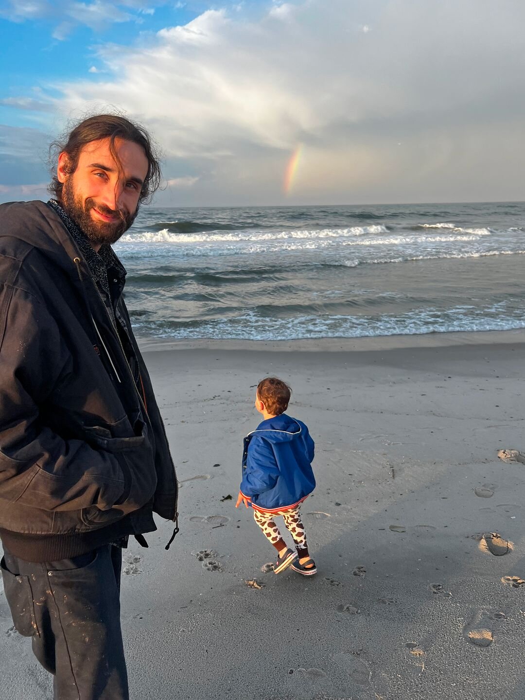 man and boy on the beach 