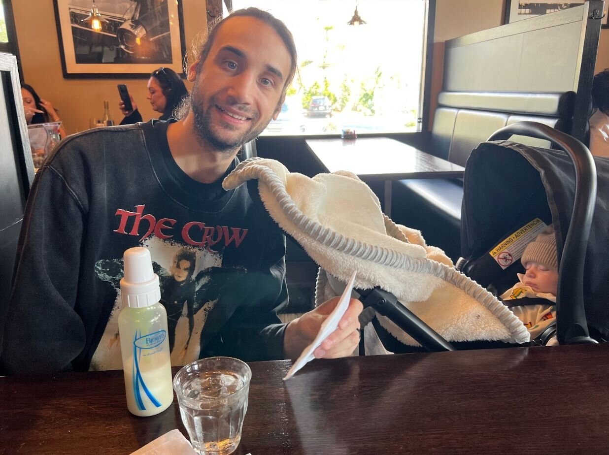 An actual image of my husband and I taking our son out OUT for the first time.
