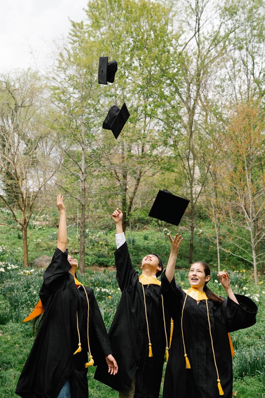 Graduates throwing their hats