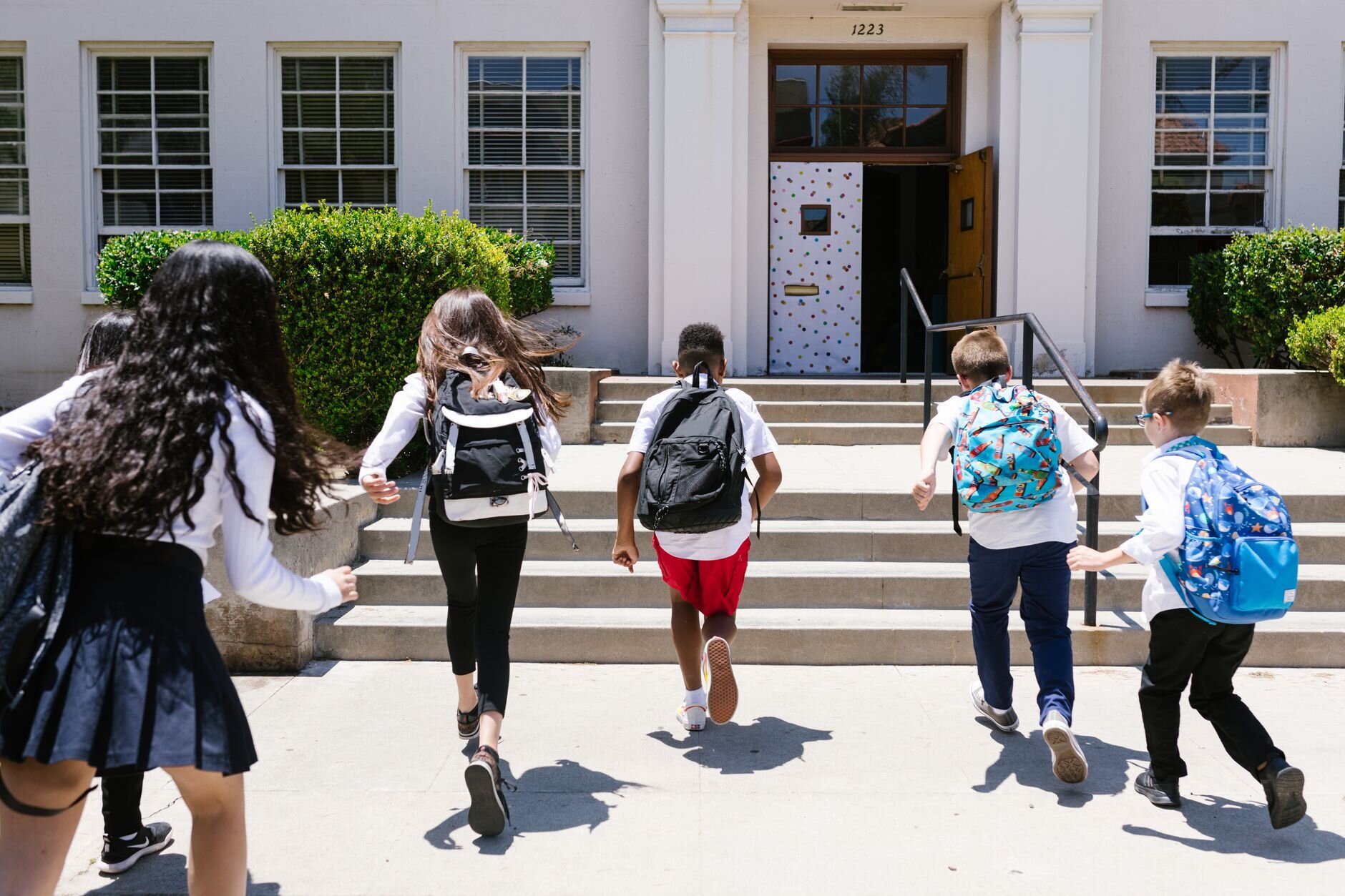 kids running into school