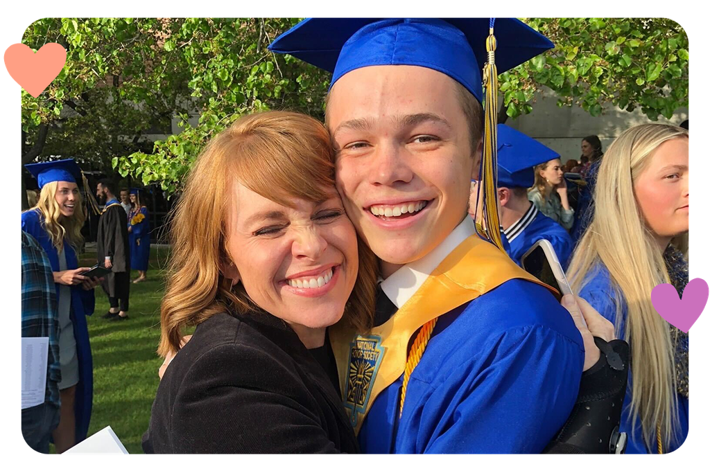 Photo of a graduate wearing a blue cap and gown.