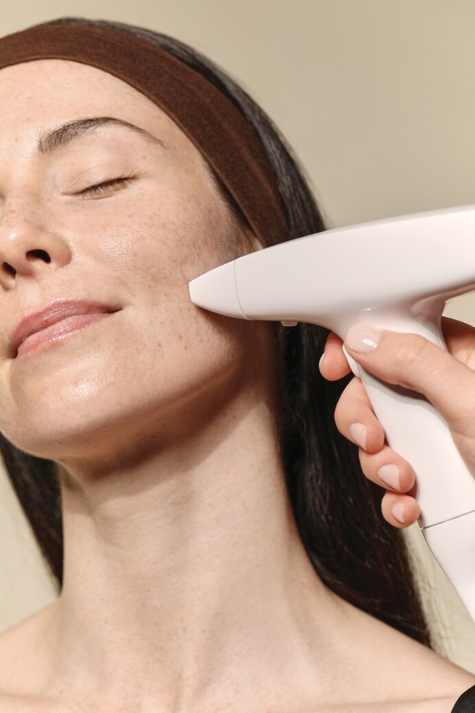 woman receiving a RESURFACING FACIAL