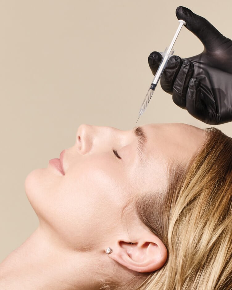 woman receiving neuromodulator injection