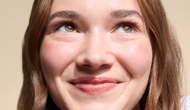 teen with clear skin smiling