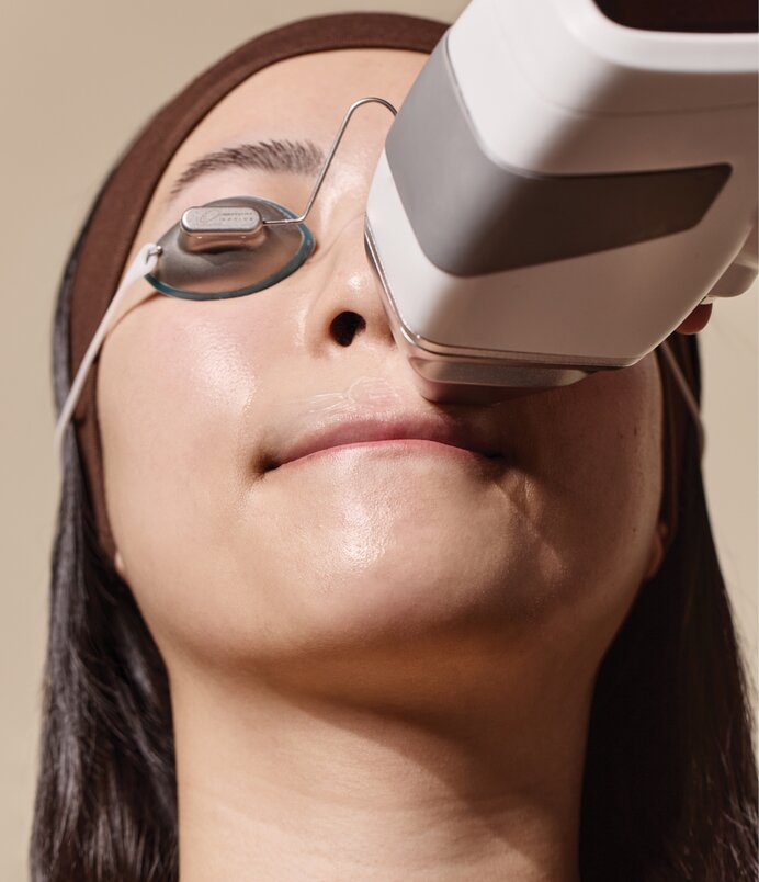 woman getting laser hair removal on upper lip