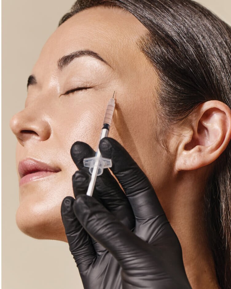 woman receiving neuromodulator injection