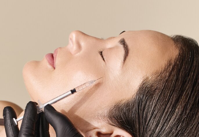 woman receiving neuromodulator injection