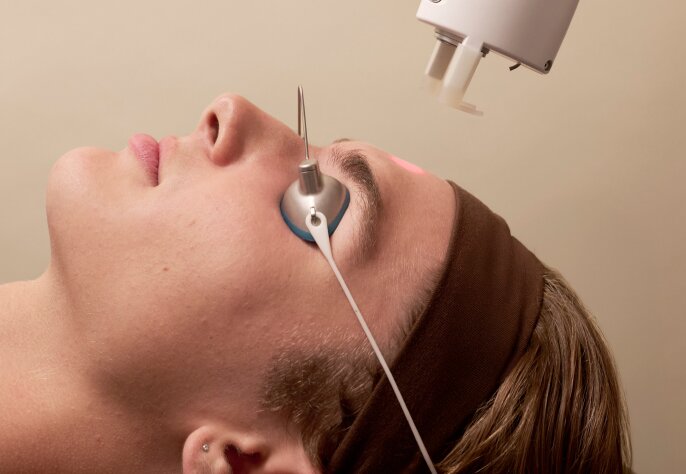 teen receiving a laser facial for acne